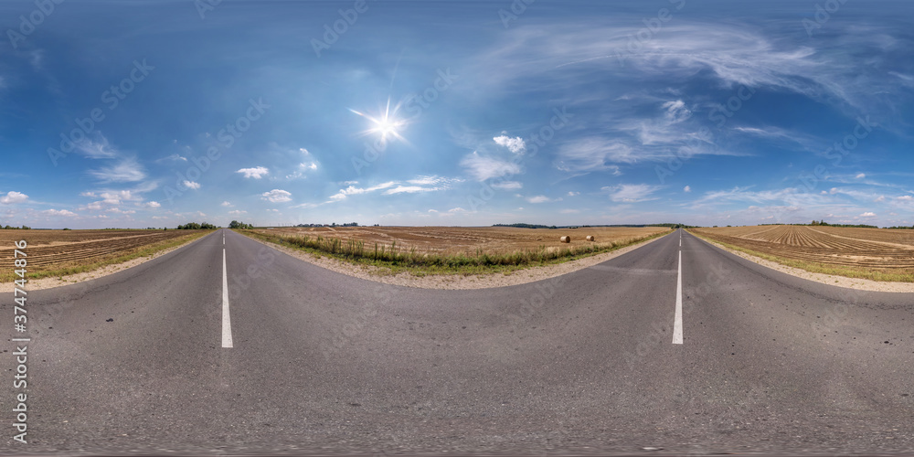 Full spherical seamless panorama 360 degrees angle view on no traffic old asphalt road among fields with clear sky and white clouds in equirectangular projection, VR AR content Full spherical seamless panorama 360 degrees angle view on no traffic old asphalt road among fields with clear sky and white clouds in equirectangular projection, VR AR content