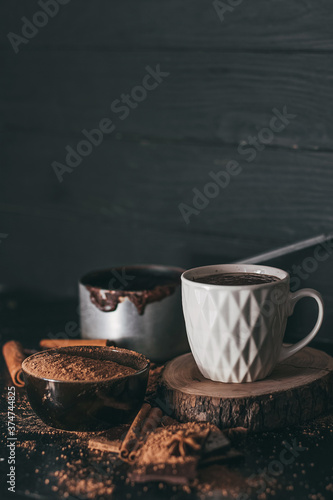 Cup of hot chocolate on dark background