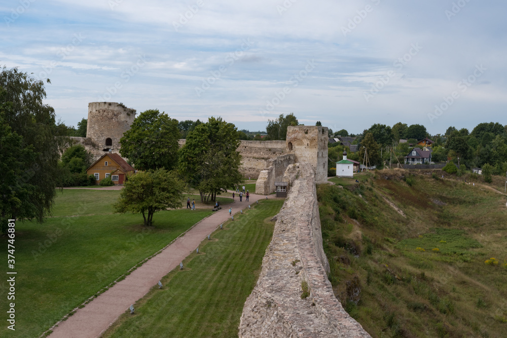 Talavskaya tower and Vyshka Tower with wall in medieval Izborsk fortress. Izborsk, Pskov region, Russia.