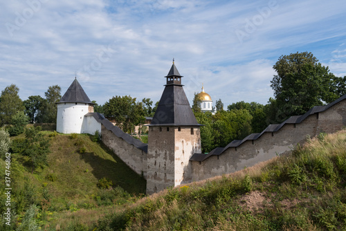 Tower of the Upper Grids and Taylovskaya Tower with fortress wall of Holy Dormition Pskovo-Pechersky Monastery. Pechory, Russia