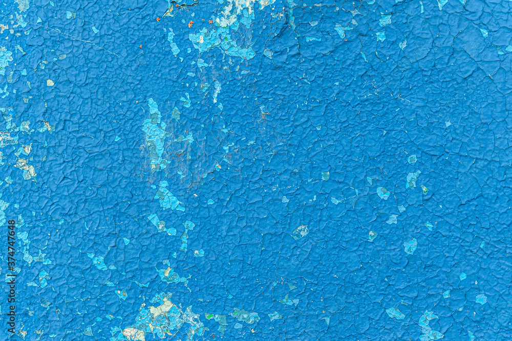 abstract background of an old shabby painted blue wall close up