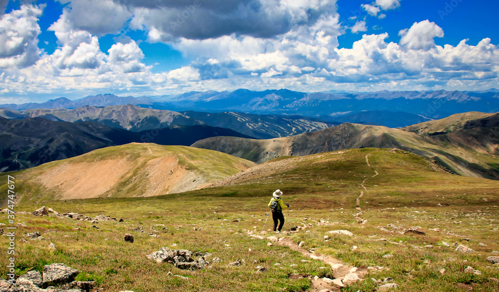 Hiker descends from the summit of Colorado's 13,000-foot Mount Sniktau near Loveland Pass.