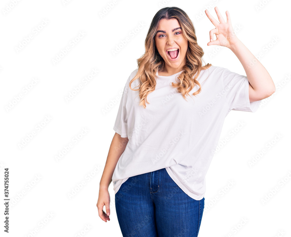 Young caucasian woman wearing casual clothes smiling positive doing ok sign with hand and fingers. successful expression. Young caucasian woman wearing casual clothes smiling positive doing ok sign with hand and fingers. successful expression.