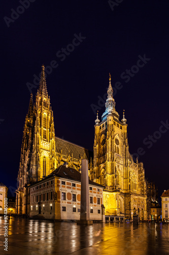 Night view of the Metropolitan Cathedral of Saints Vitus (St. Vitus Cathedral) with light illumination located in Prague Castle, Czech Republic