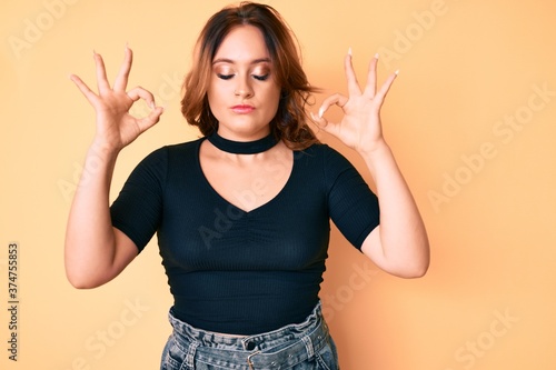 Young beautiful caucasian woman wearing casual clothes relax and smiling with eyes closed doing meditation gesture with fingers. yoga concept.