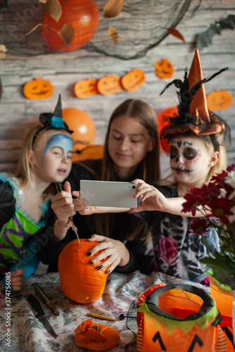 Children dressed in costumes celebrate Halloween