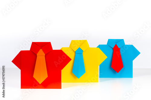 Three origami men stand sho...