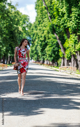Young Woman Walking in a Park © Provisualstock.com
