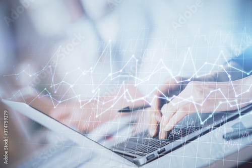 Double exposure of woman hands typing on computer and forex chart hologram drawing. Stock market invest concept. © peshkova