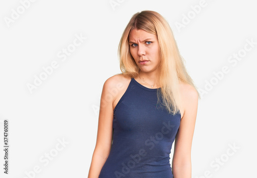 Young beautiful blonde woman wearing casual dress skeptic and nervous, frowning upset because of problem. negative person. © Krakenimages.com