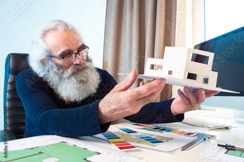 An elderly architect consid...
