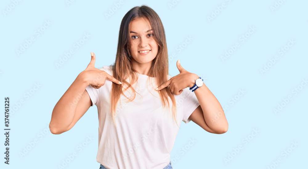 Beautiful caucasian woman wearing casual white tshirt looking confident with smile on face, pointing oneself with fingers proud and happy. Beautiful caucasian woman wearing casual white tshirt looking confident with smile on face, pointing oneself with fingers proud and happy.