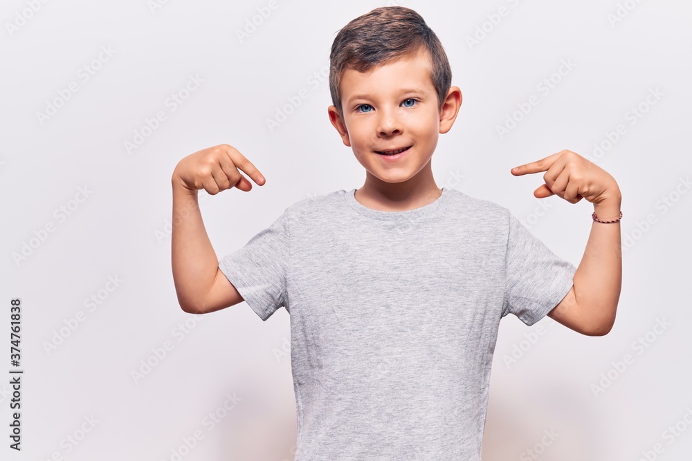 Cute blond kid wearing casual clothes looking confident with smile on face, pointing oneself with fingers proud and happy.