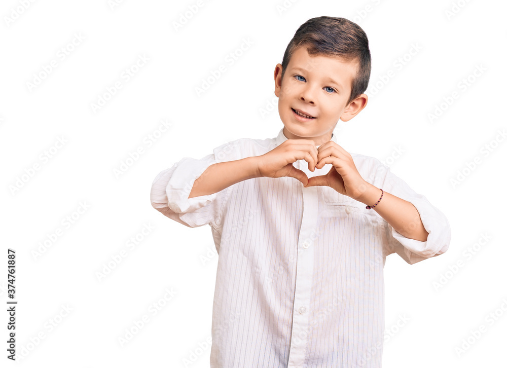 Cute blond kid wearing elegant shirt smiling in love doing heart symbol shape with hands. romantic concept. Cute blond kid wearing elegant shirt smiling in love doing heart symbol shape with hands. romantic concept.