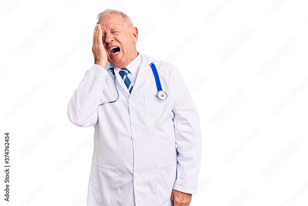 Senior handsome grey-haired man wearing doctor coat and stethoscope yawning tired covering half face, eye and mouth with hand. face hurts in pain. Senior handsome grey-haired man wearing doctor coat and stethoscope yawning tired covering half face, eye and mouth with hand. face hurts in pain.