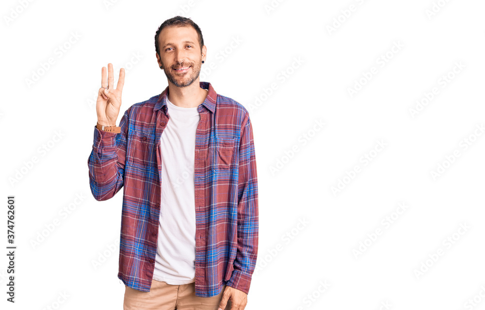 Young handsome man wearing casual clothes showing and pointing up with fingers number three while smiling confident and happy. Young handsome man wearing casual clothes showing and pointing up with fingers number three while smiling confident and happy.