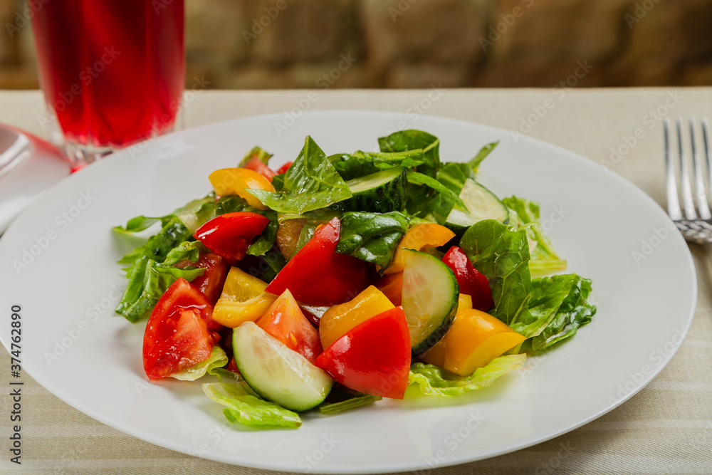 Summer fresh salad of tomato cucumber leaves lettuce. Summer fresh salad of tomato cucumber leaves lettuce.