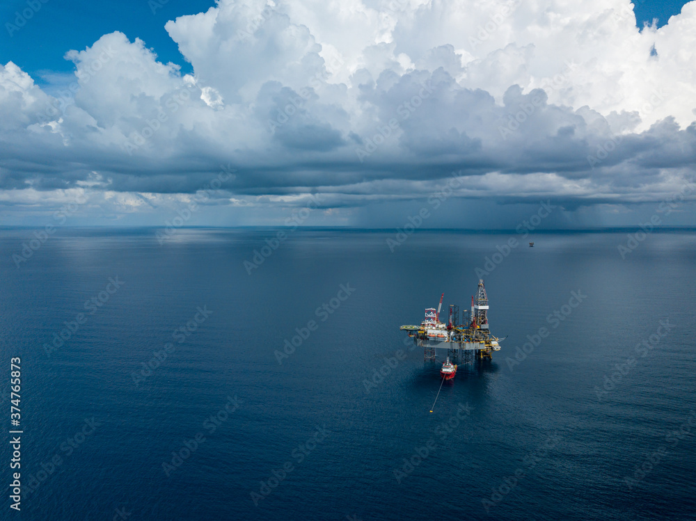 Aerial view from a drone of an offshore jack up rig at the offshore location during day time