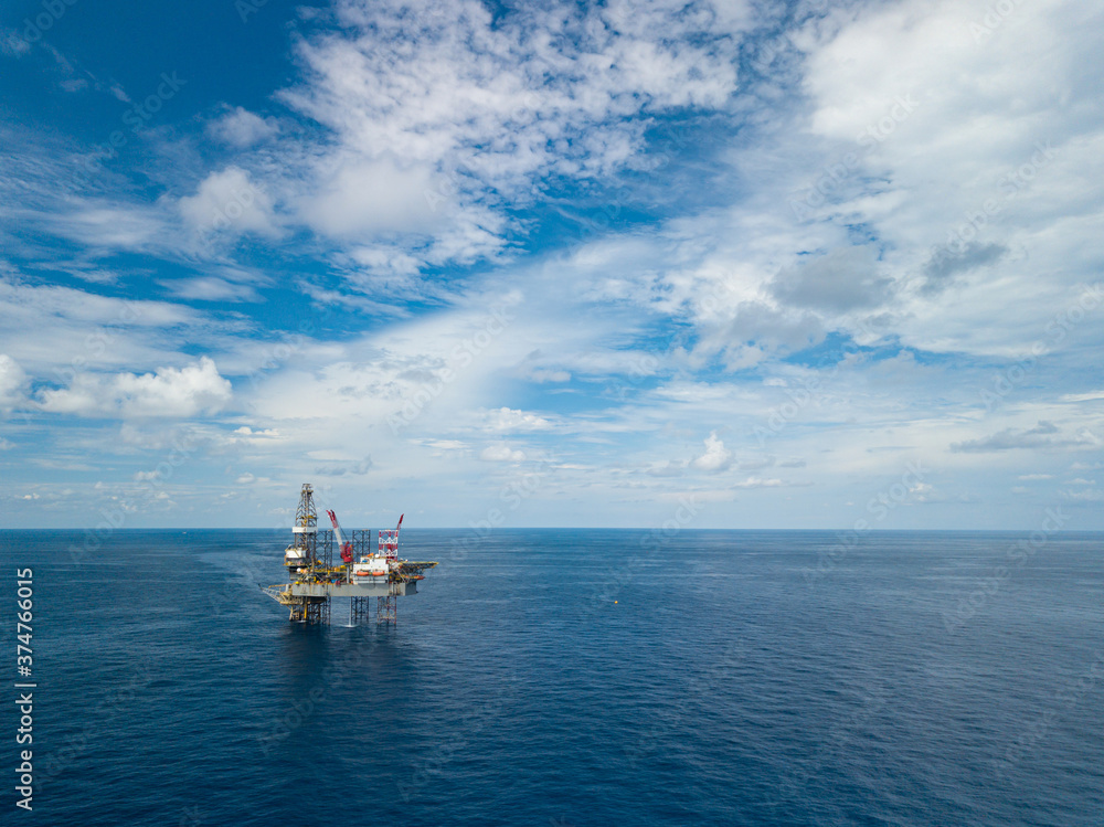 Obraz premium Aerial view from a drone of an offshore jack up rig at the offshore location during day time