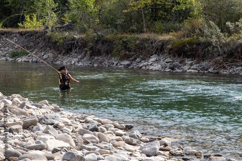 woman fly fishing in a river