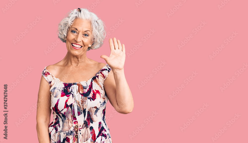 Senior grey-haired woman wearing casual clothes showing and pointing up with fingers number five while smiling confident and happy. Senior grey-haired woman wearing casual clothes showing and pointing up with fingers number five while smiling confident and happy.