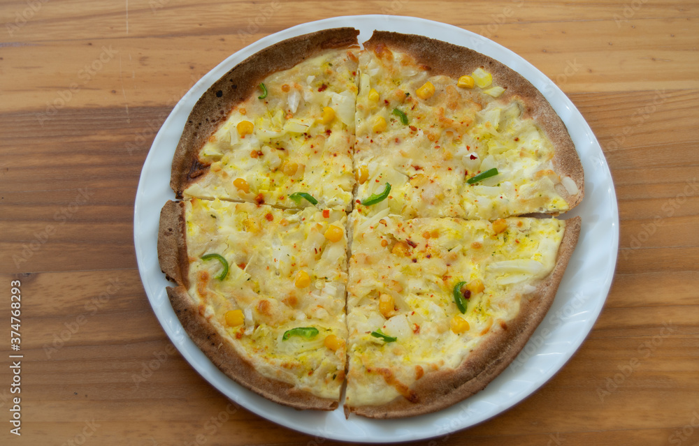 homemade peasant pizza with onion, corn and pepper homemade peasant pizza with onion, corn and pepper