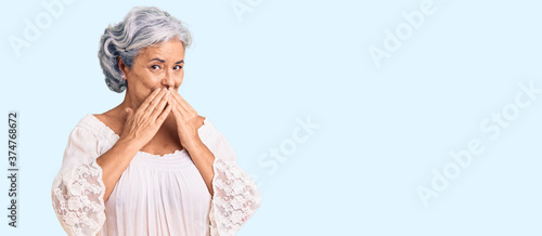 фотографія Senior woman with gray hair wearing bohemian style laughing and embarrassed gigg