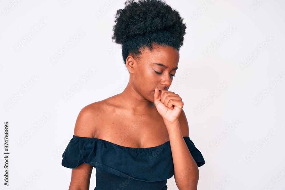 Young african american woman wearing casual clothes feeling unwell and coughing as symptom for cold or bronchitis. health care concept. Young african american woman wearing casual clothes feeling unwell and coughing as symptom for cold or bronchitis. health care concept.