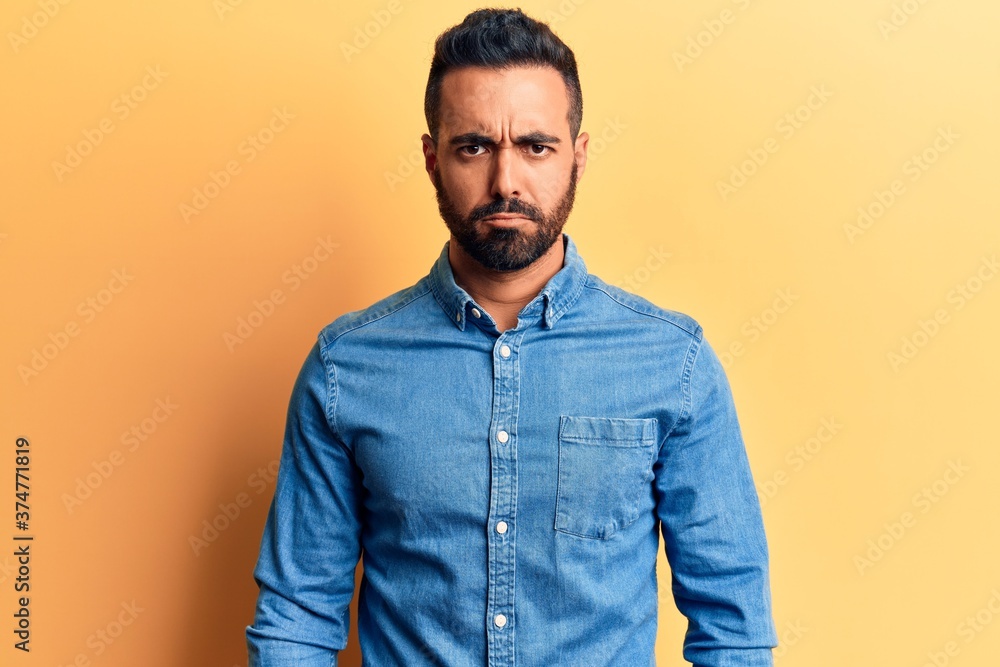 Young hispanic man wearing casual clothes skeptic and nervous, frowning upset because of problem. negative person. Young hispanic man wearing casual clothes skeptic and nervous, frowning upset because of problem. negative person.