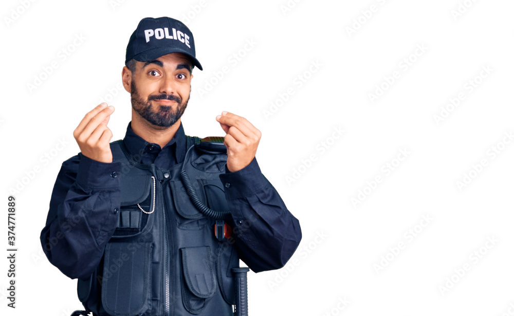 Young hispanic man wearing police uniform doing money gesture with hands, asking for salary payment, millionaire business Young hispanic man wearing police uniform doing money gesture with hands, asking for salary payment, millionaire business