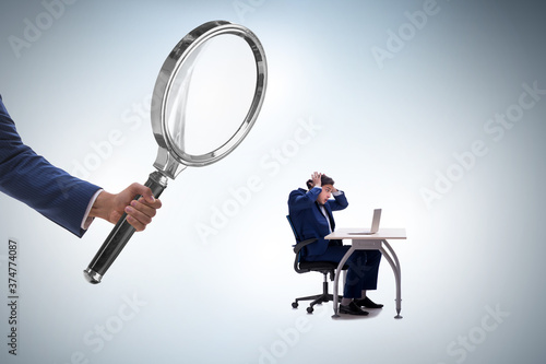 Photos Concept of employee monitoring by boss