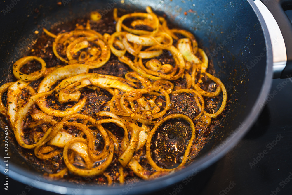 simple food ingredients, caramelised onion rings with curry and spices simple food ingredients, caramelised onion rings with curry and spices