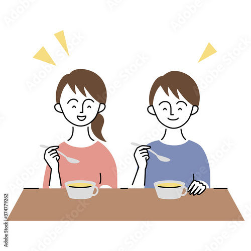 楽しそうに食事をとる少年・少女