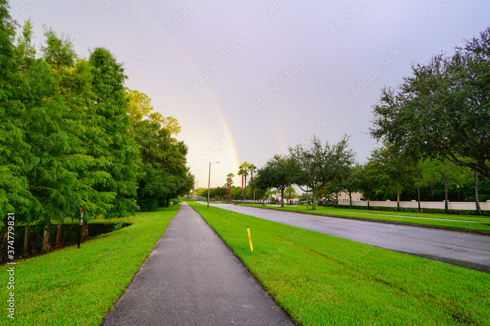 Naklejka premium Beautiful double rainbow in summer