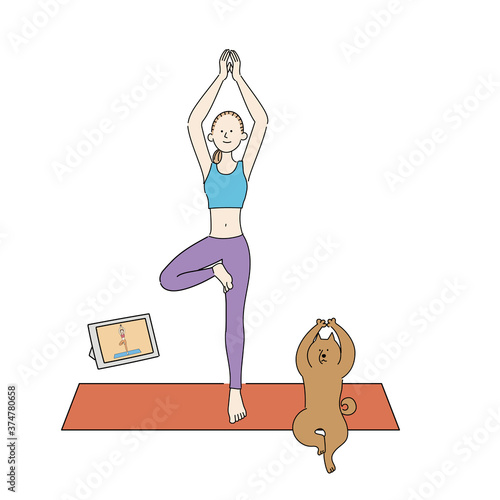 オンラインでヨガのレッスンを受ける女性と犬　立ち木のポーズ