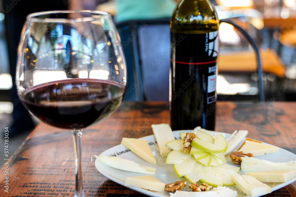 red wine glass bottle with fruit salad in a cafe restaurant red wine glass bottle with fruit salad in a cafe restaurant