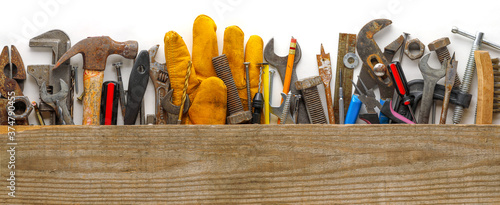 Valokuva Worn wood plank on used and dirty work tools for home improvement or diy repair projects