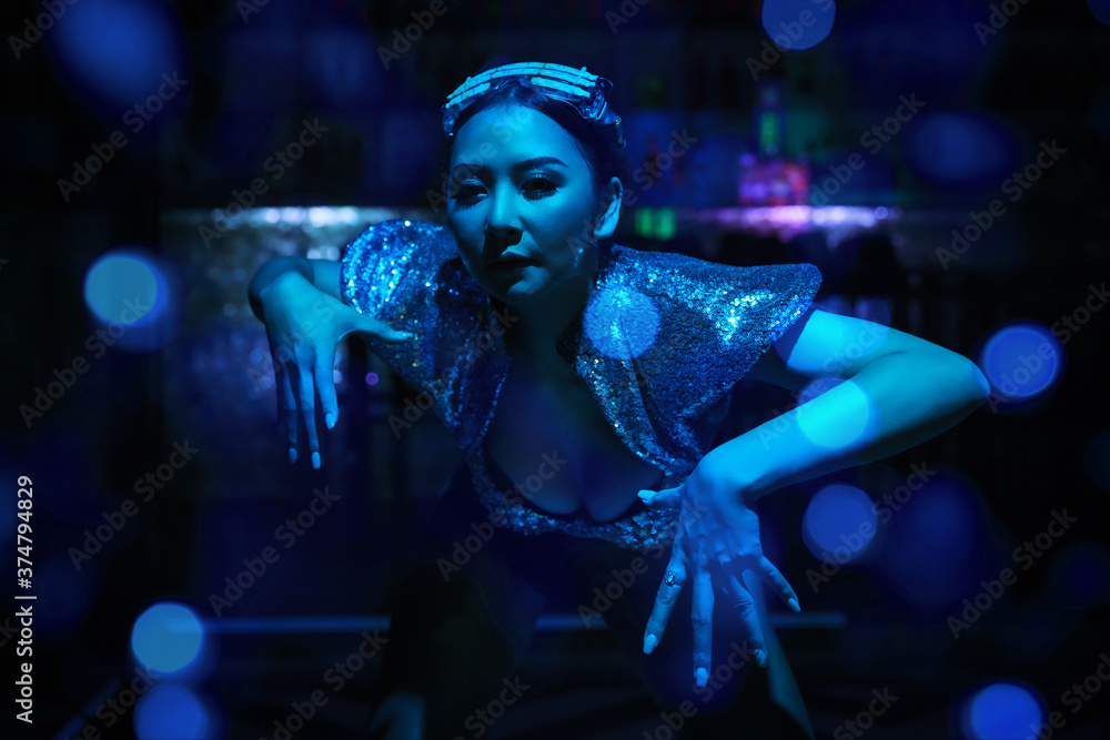 art portrait of woman model in fancy dress glowing in blue neon light art portrait of woman model in fancy dress glowing in blue neon light