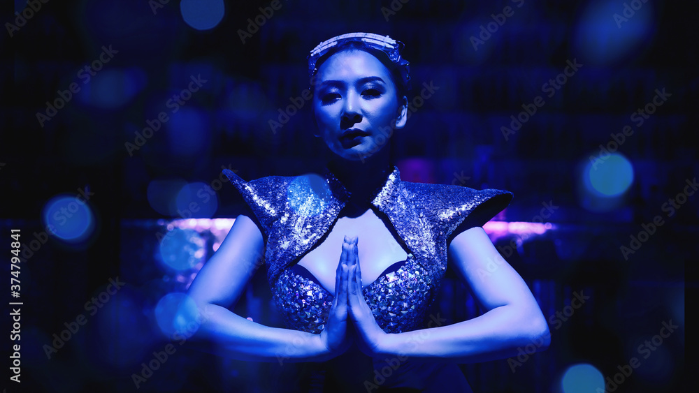 art portrait of woman model in fancy dress glowing in blue neon light art portrait of woman model in fancy dress glowing in blue neon light