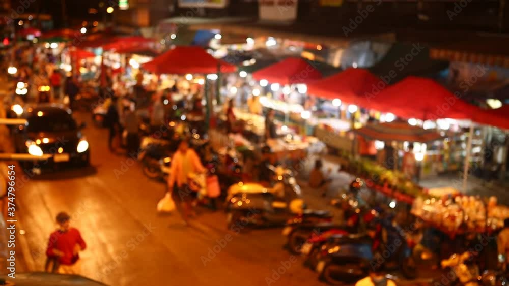 Blurred night street market on Witchayanon road ,in Chiangmai Thailand Blurred night street market on Witchayanon road ,in Chiangmai Thailand