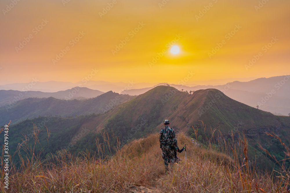 Forester or forest ranger hiking in the mountains at Khao Chang Puak mountain Thailand
