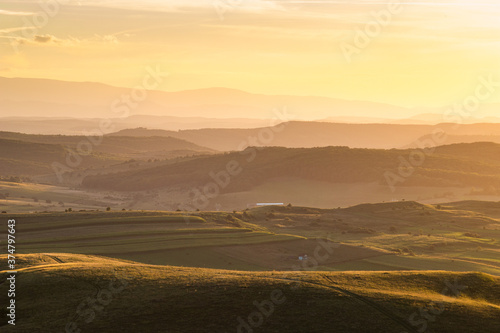 rolling hills in autumn sunset nature background