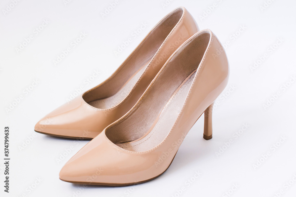 beige classical shoes with white backgrond beige classical shoes with white backgrond