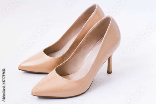 beige classical shoes with white backgrond