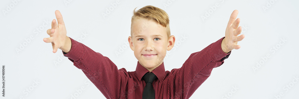 Portrait of a schoolboy with open arms who smiles. Portrait of a schoolboy with open arms who smiles.