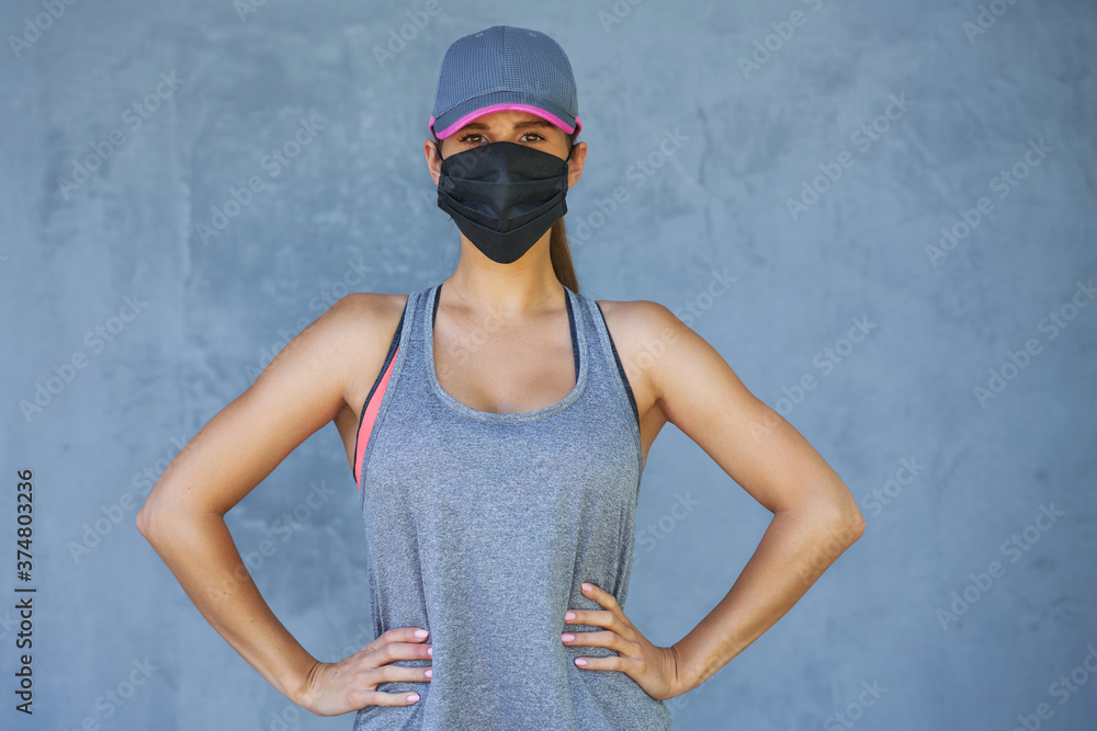 Female runner using protective mask during coronavirus pandemic Female runner using protective mask during coronavirus pandemic