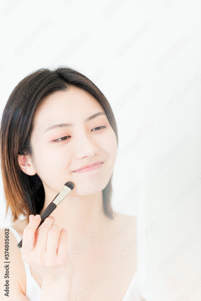 A beautiful young asian woman in make-up


