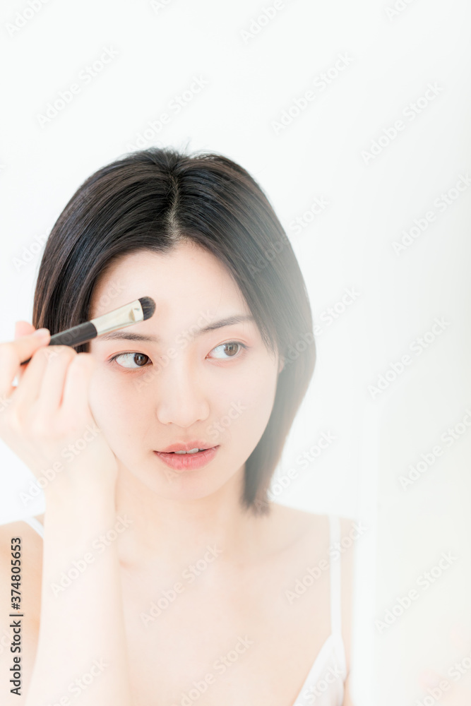 A beautiful young asian woman in make-up

