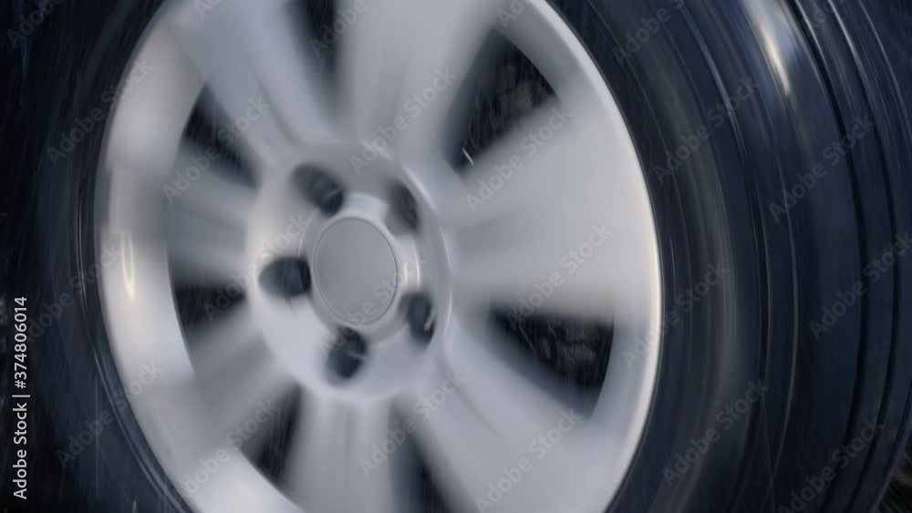 Vidéo Stock Added shaking from moving the car! Car wheel with shiny