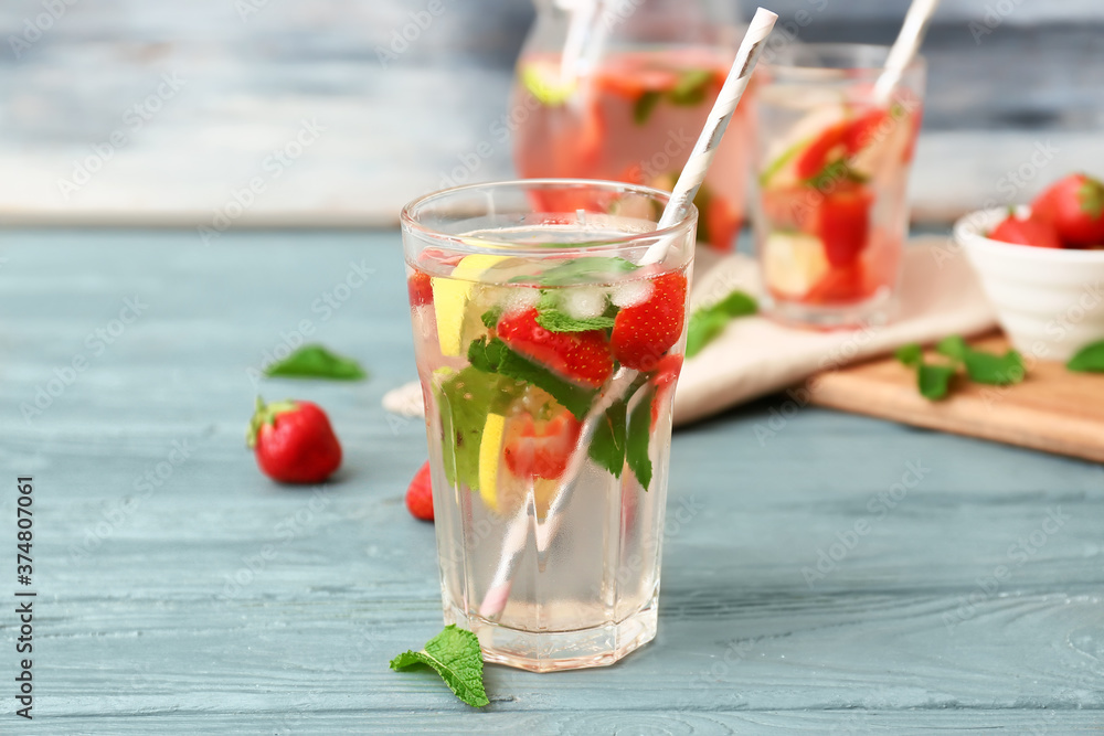 Glass of tasty strawberry mojito on table Glass of tasty strawberry mojito on table